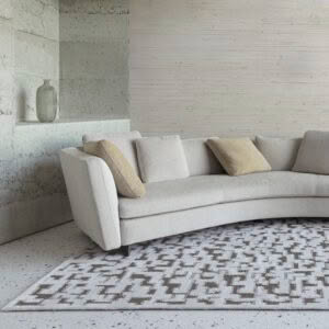 Modern curved sofa in a minimalist living room