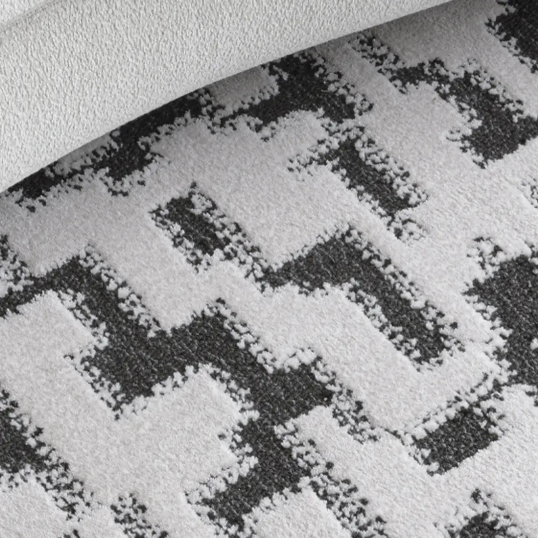 Close-up of patterned black and white rug