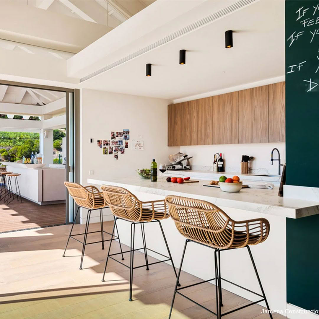 Tubelum-ceiling-3 Modern kitchen with bar stools and open patio doors