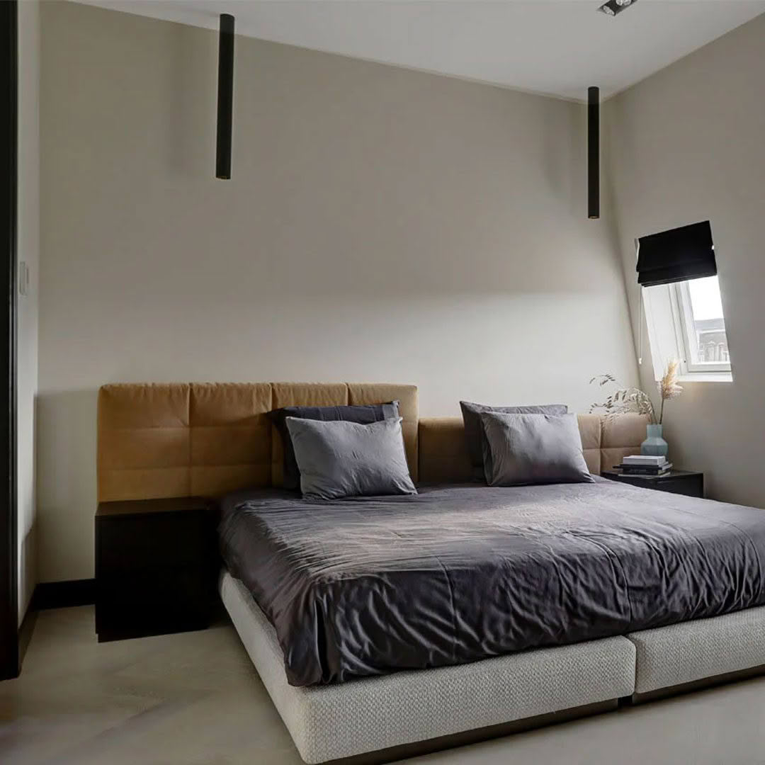 Tubelum-ceiling Modern bedroom with large bed and minimalist decor