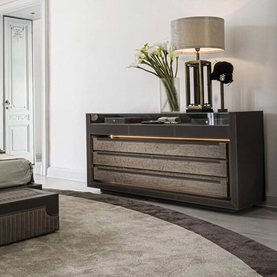 Elegant bedroom with modern gray dresser and table lamp