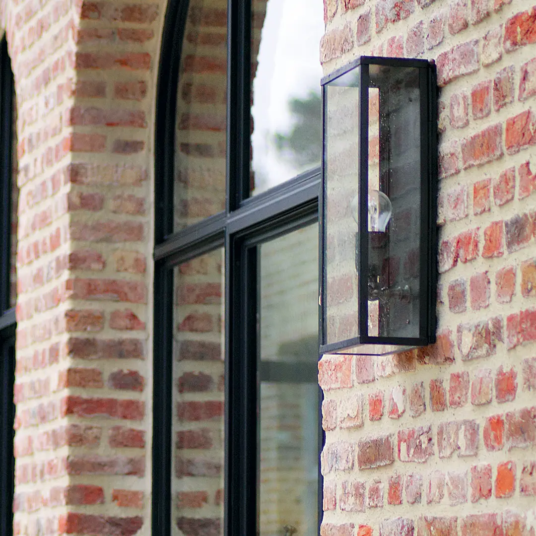 Outdoor wall lantern on a red brick wall