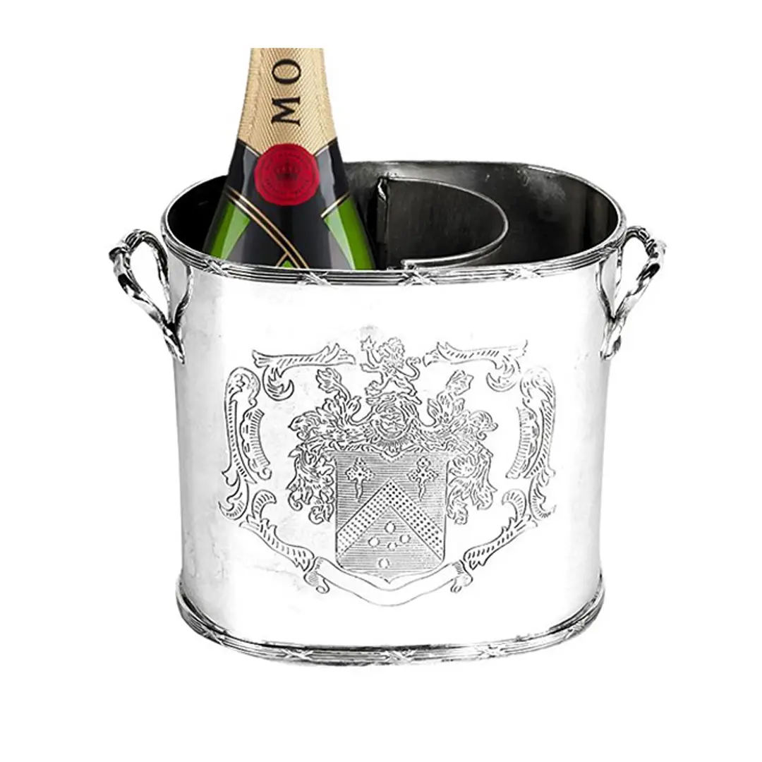 Champagne bottle in engraved silver ice bucket