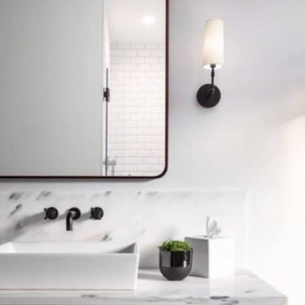Modern bathroom with marble sink and wall-mounted faucet