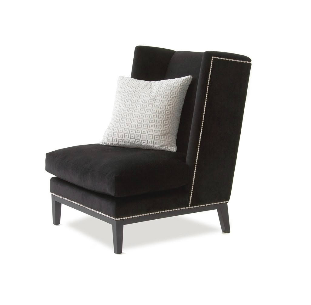 Elegant black high-back chair with decorative white cushion