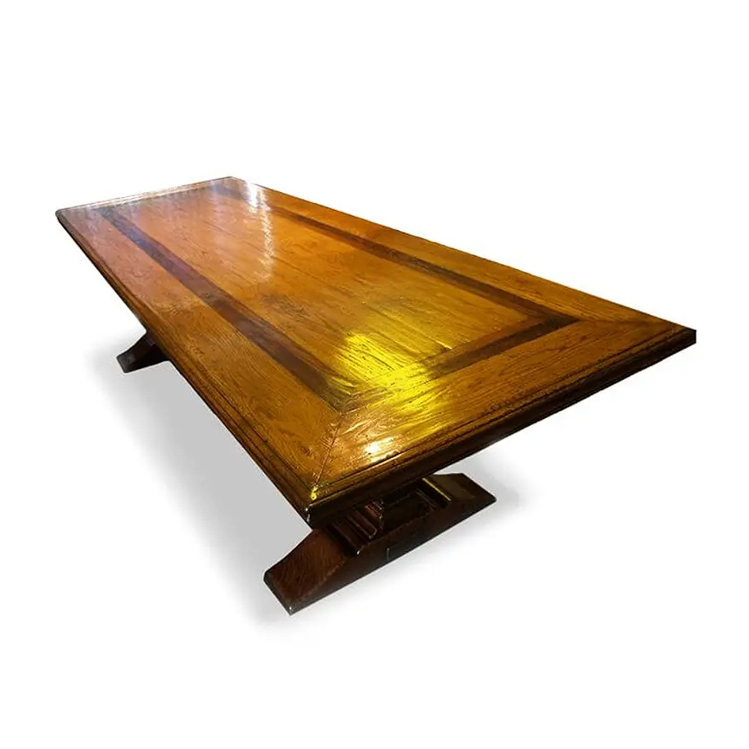 Polished wooden dining table on trestle base