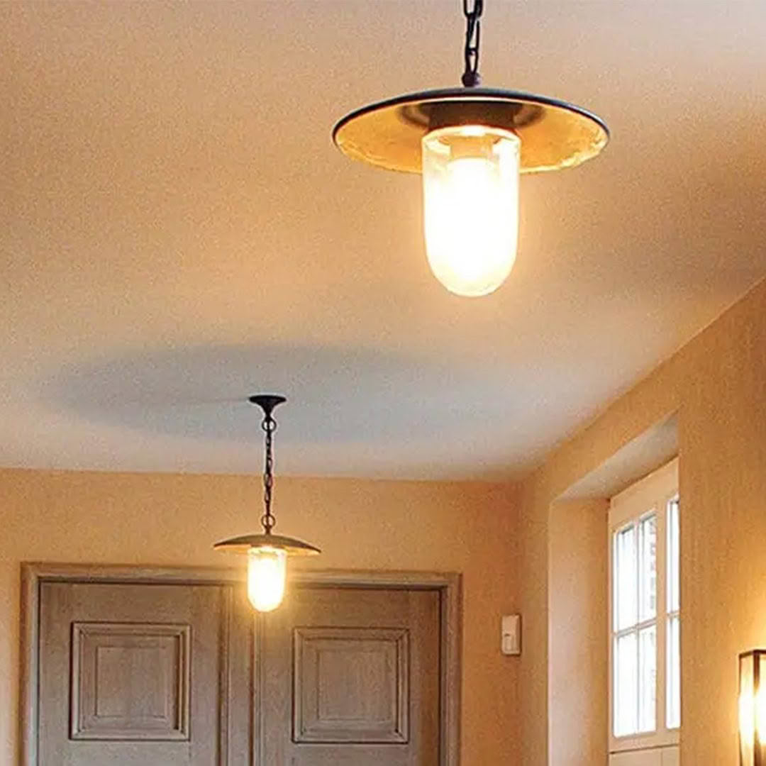 Elegant ceiling light fixture above double doors