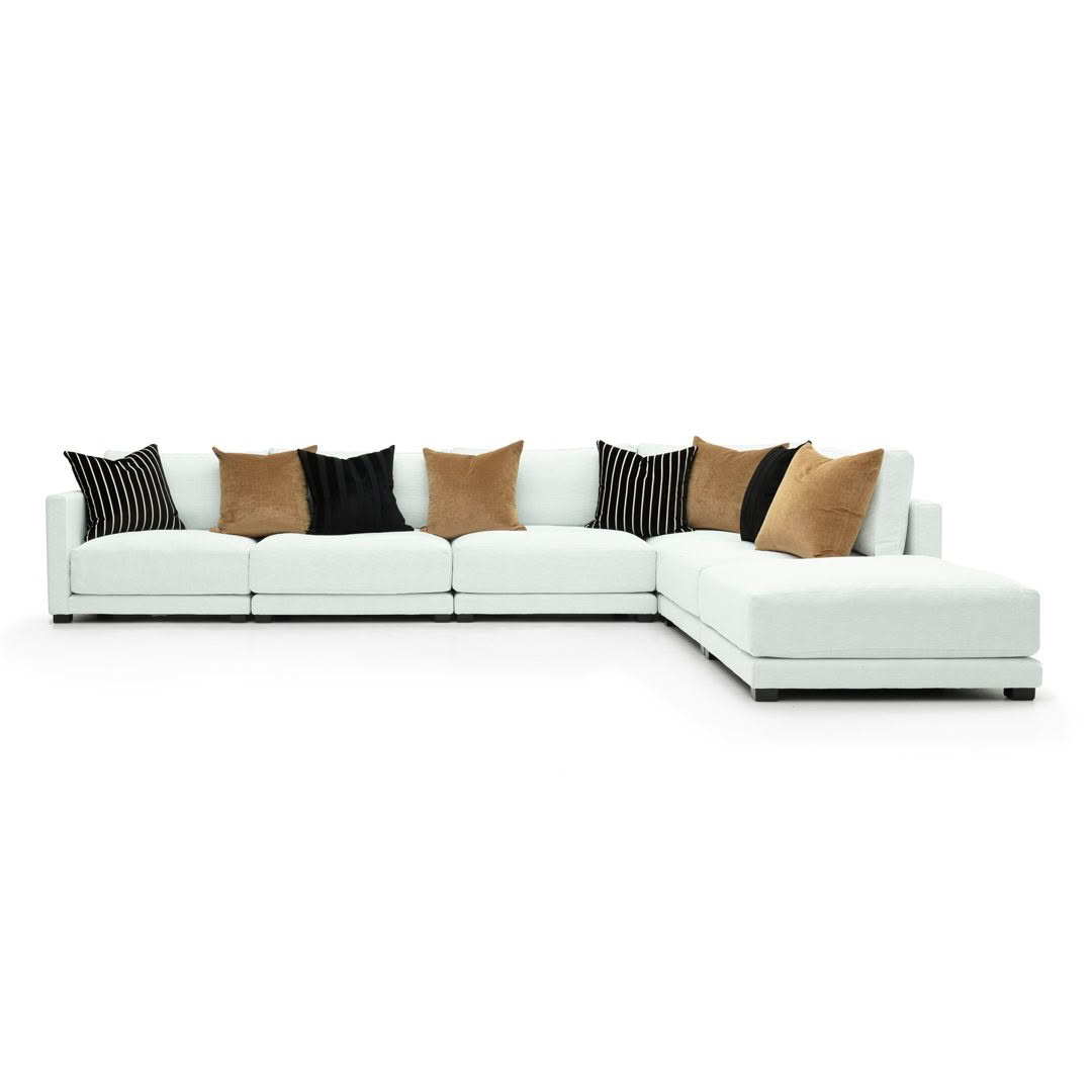 White sectional sofa with decorative pillows
