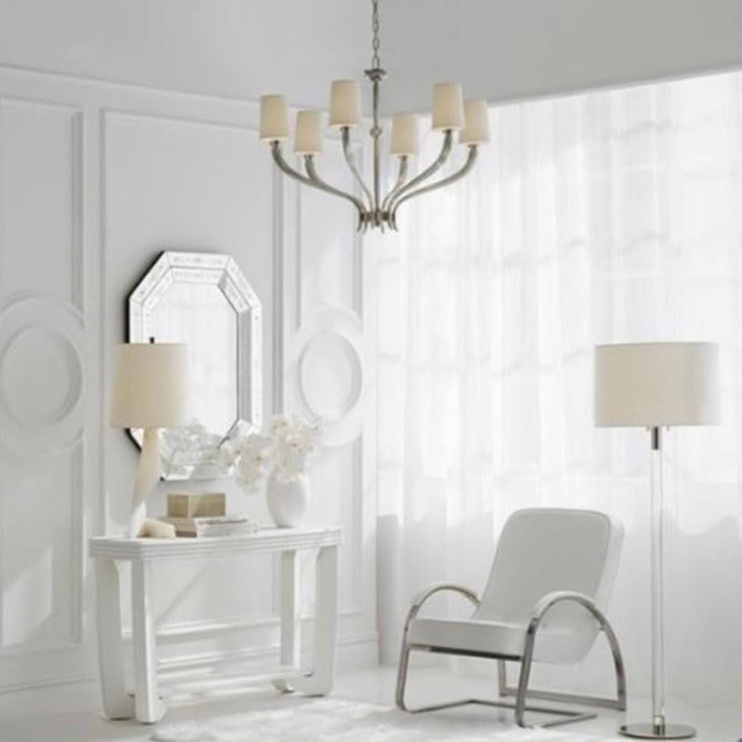 Elegant white living room with modern furniture and chandelier