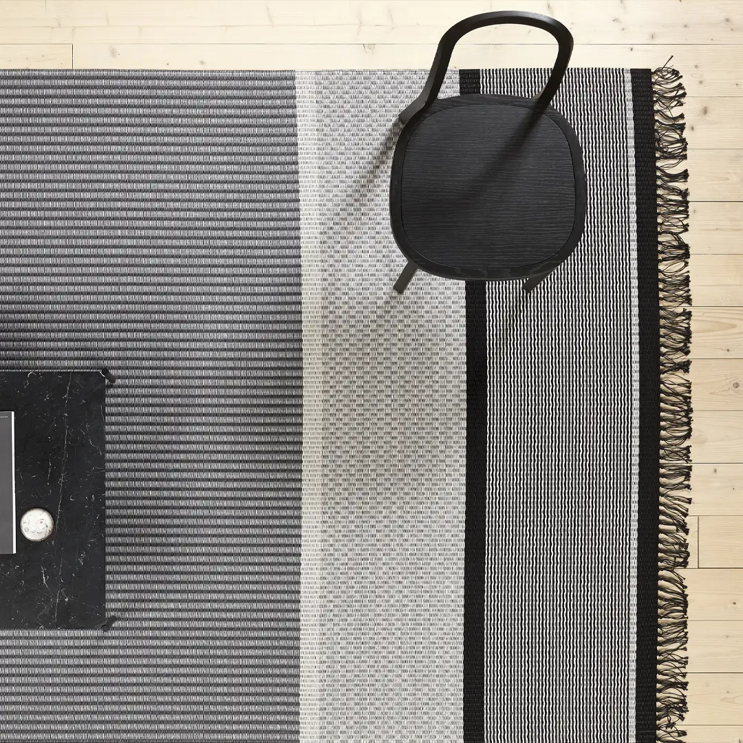 wn-SAN-FRANCISCO-RUG_1 Black chair on striped rugs with marble accent