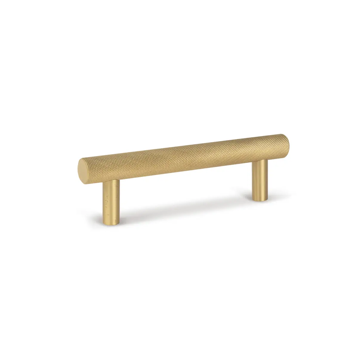 Textured gold cabinet handle on white background