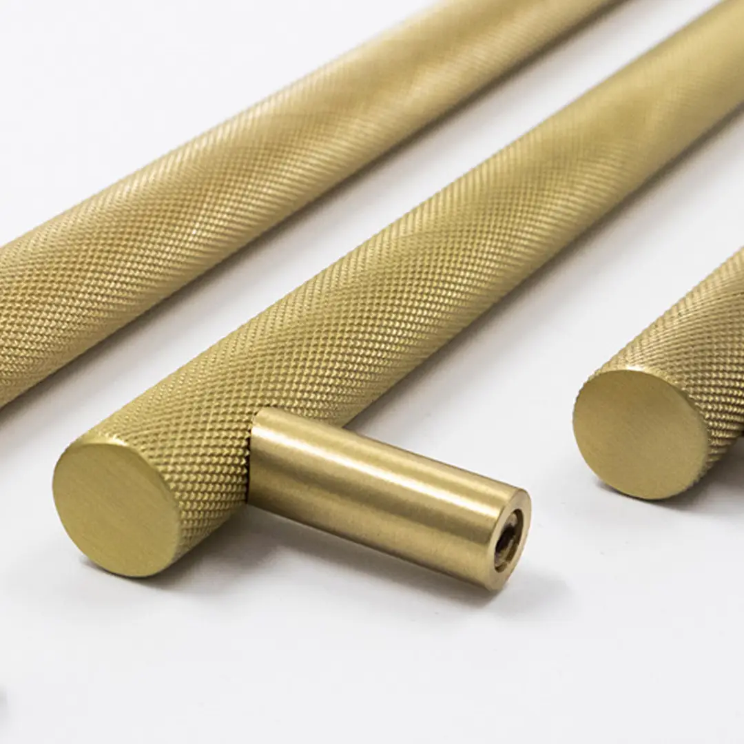 Brass rods with textured grips on white background