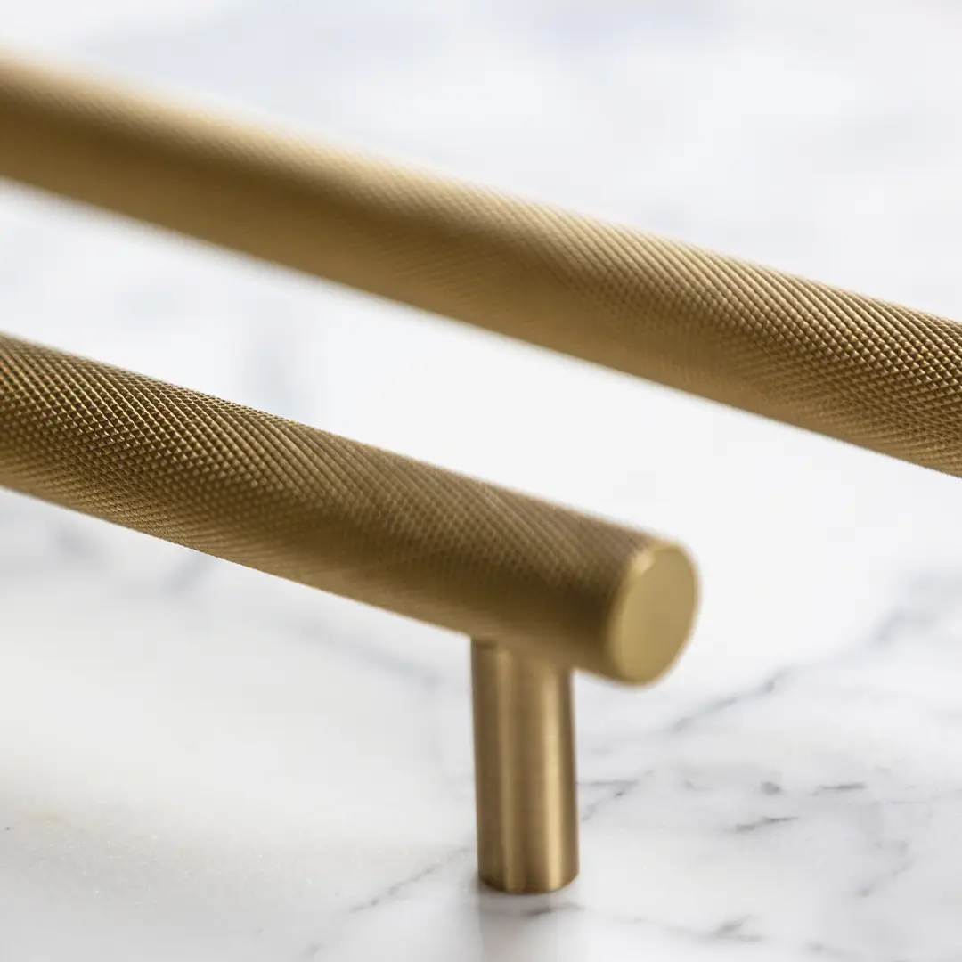 Close-up of textured brass cabinet handles