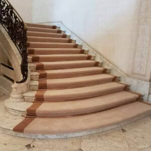 Elegant curved staircase with ornate railing