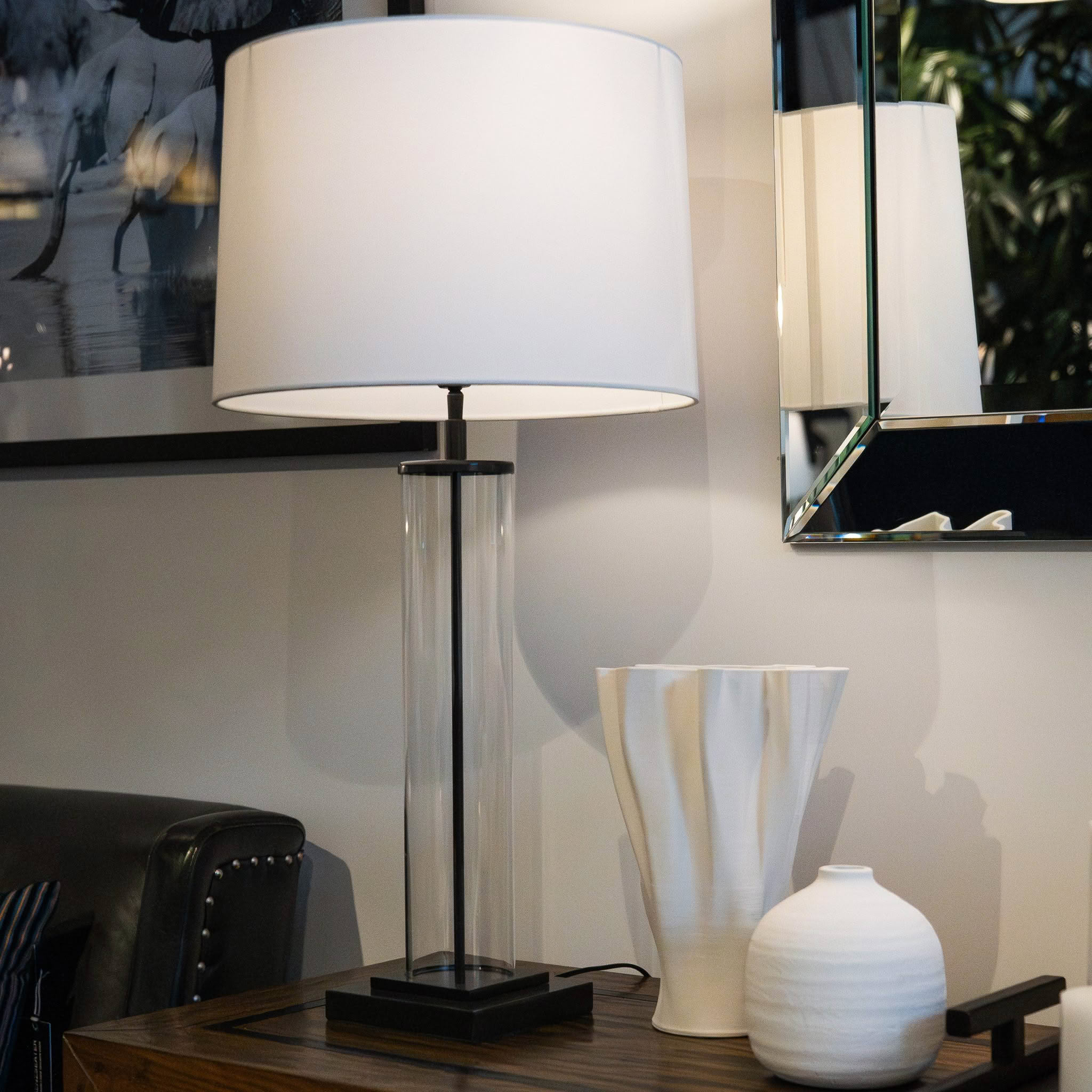 Elegant lamp and vases on a wooden table