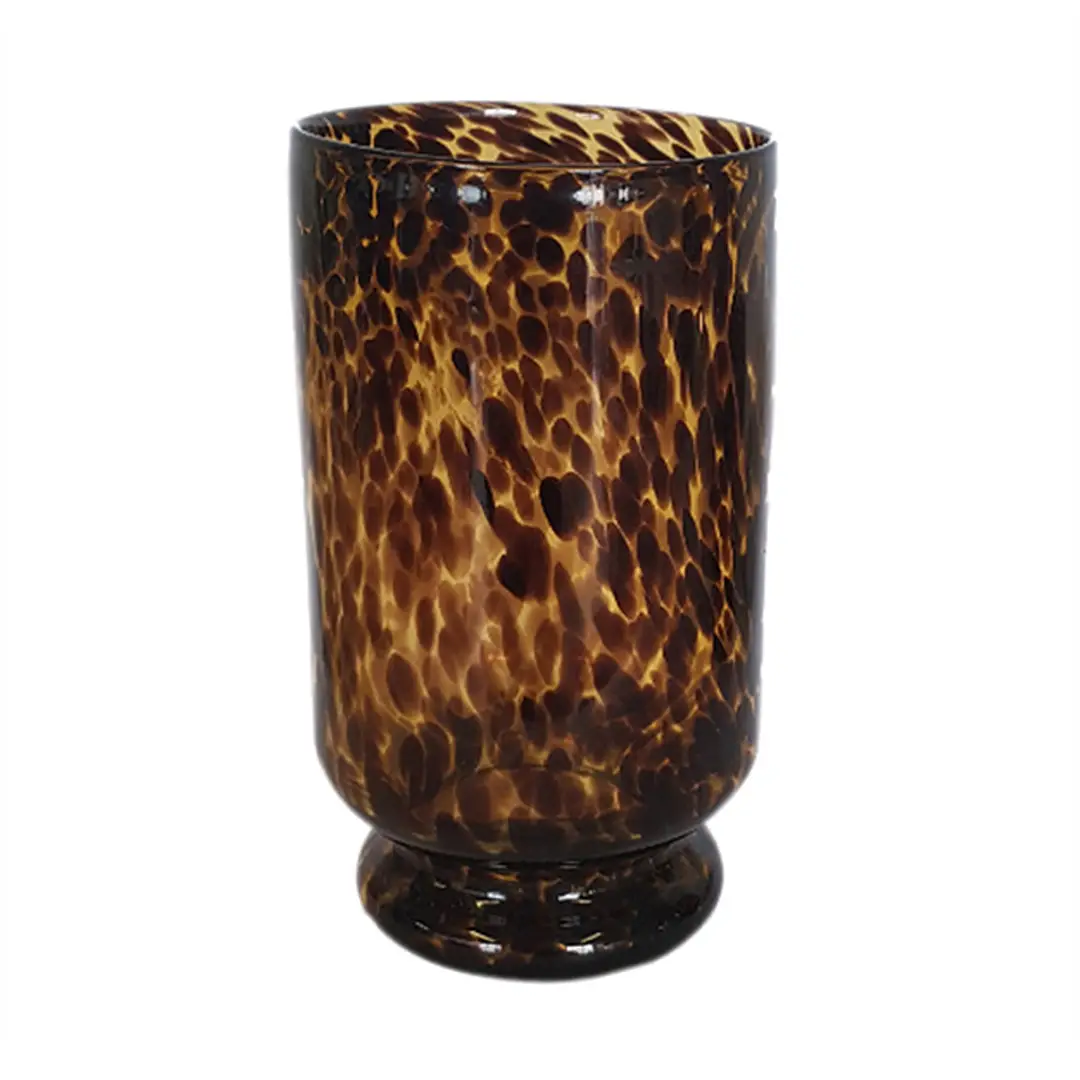 Tortoiseshell patterned glass tumbler isolated on white