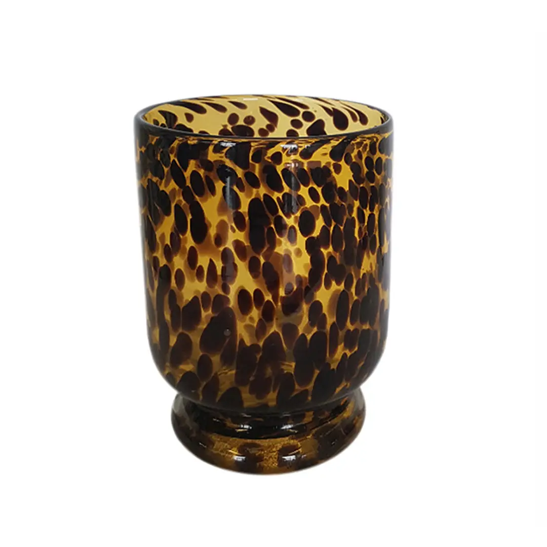 Tortoiseshell pattern glass cup on white background