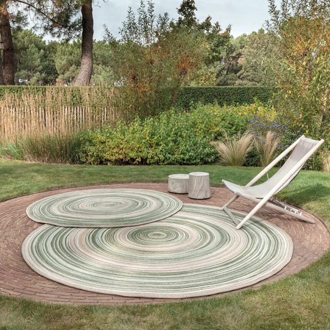 Circular outdoor rugs on patio with lounge chair
