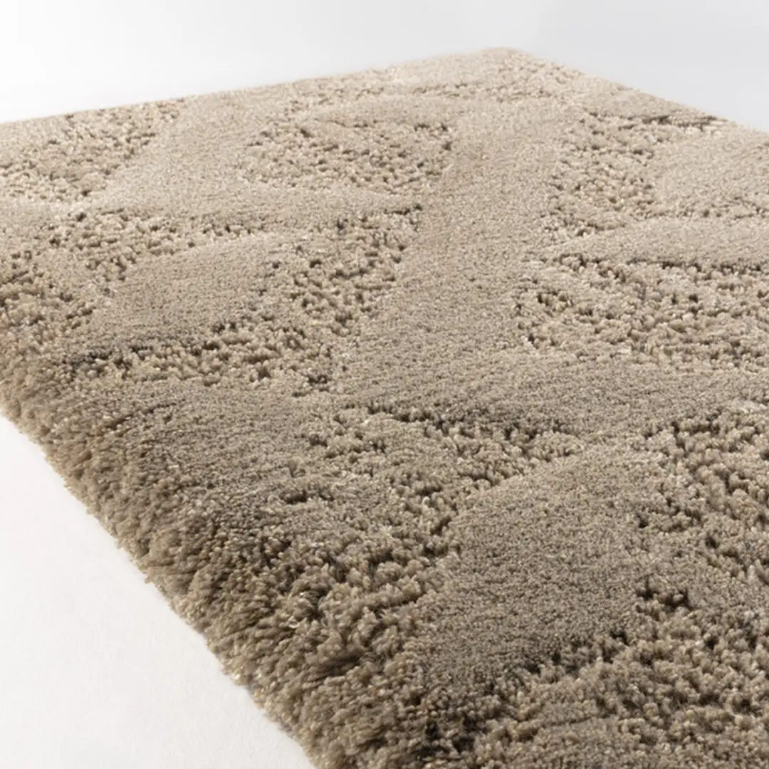 Thick beige textured area rug with geometric design