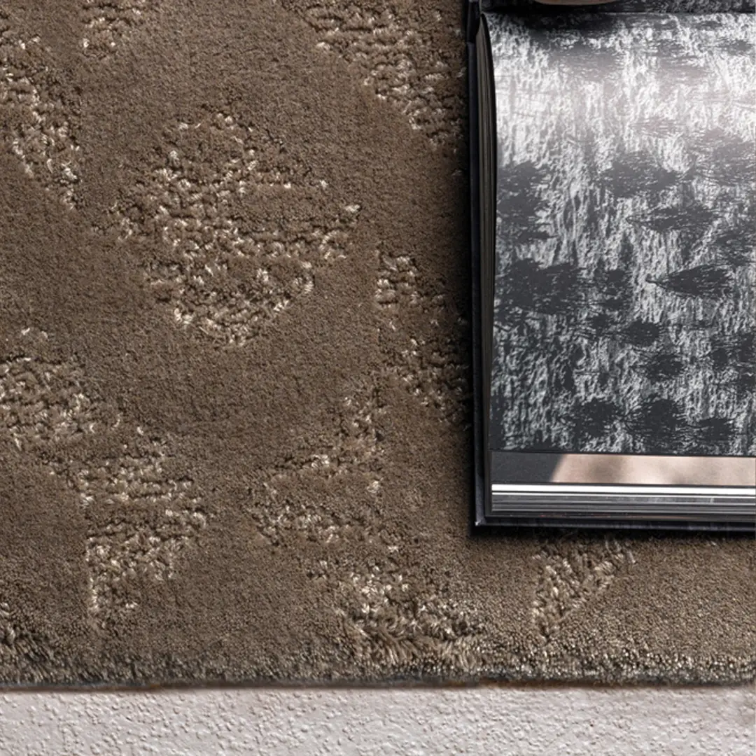 Abstract black and white book on textured brown carpet