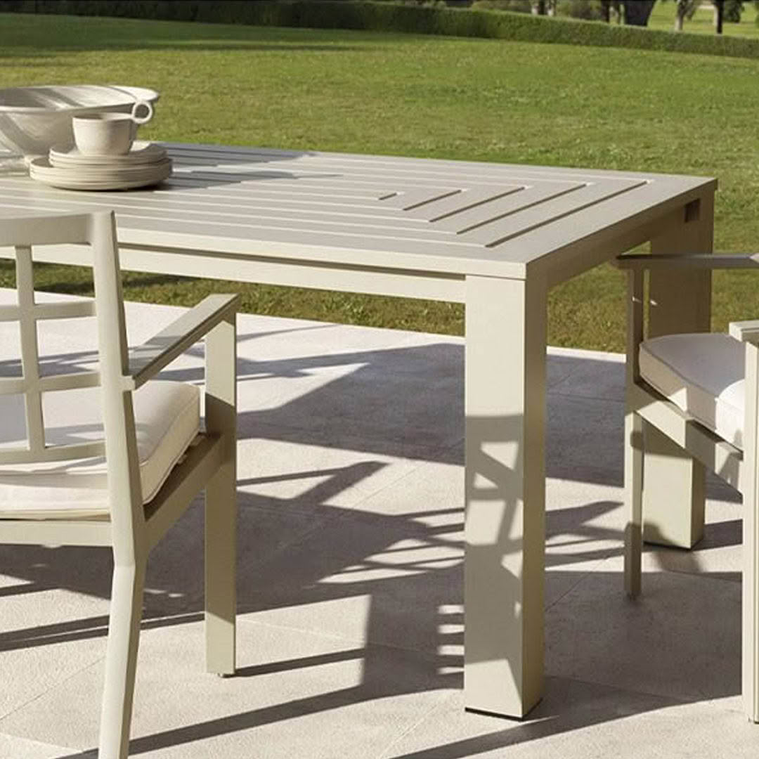 Outdoor dining table setup in sunny garden