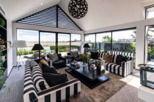 Modern living room with striped sofas and panoramic view