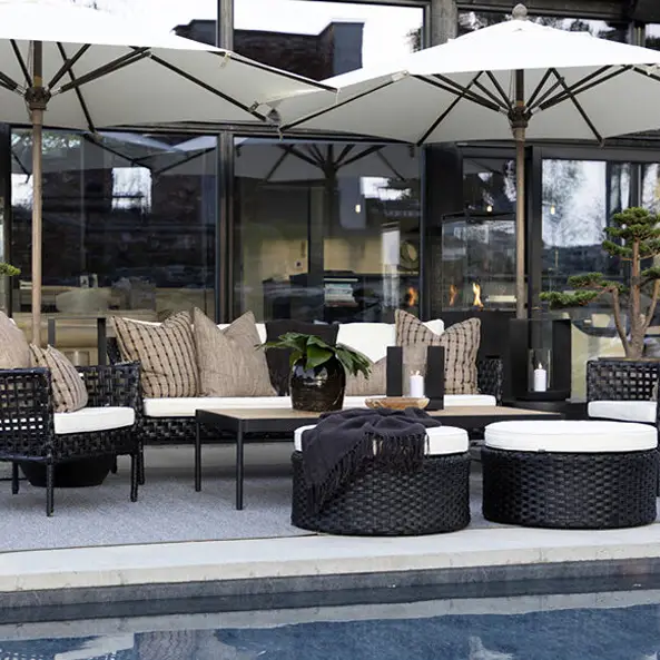 Modern outdoor patio with furniture and umbrellas