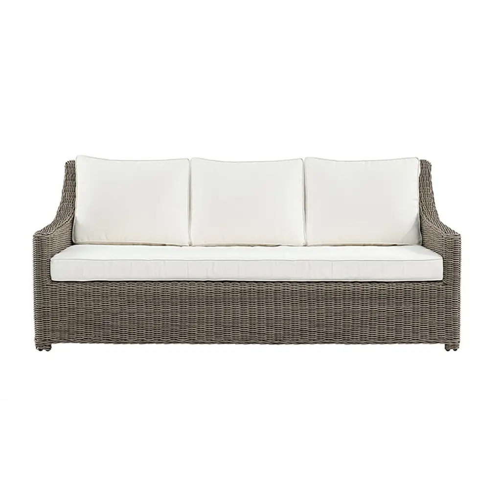 Wicker outdoor sofa with white cushions