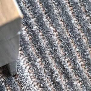Close-up of textured gray striped carpet