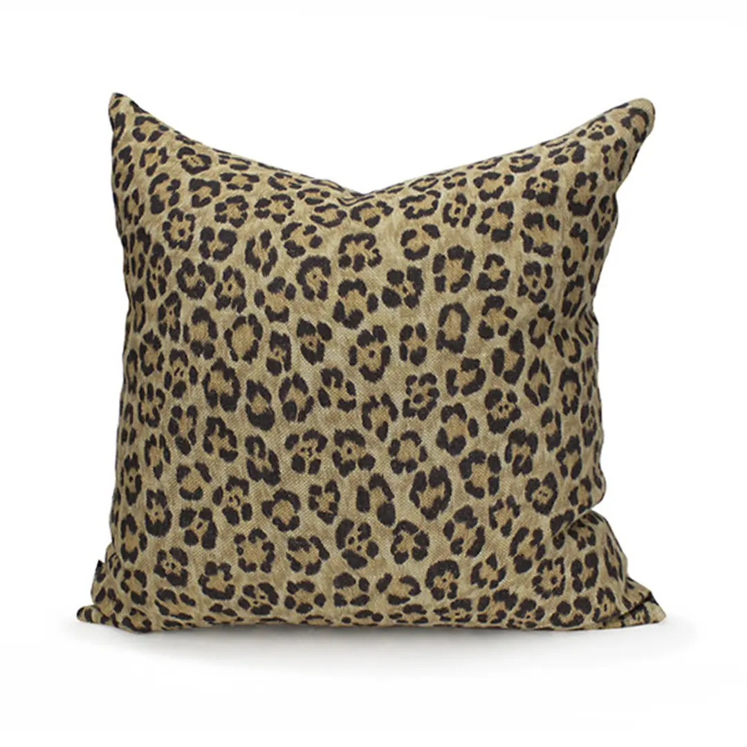 Decorative leopard print throw pillow on white background