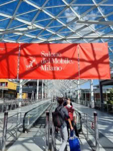 Visitors entering Salone del Mobile Milan under glass roof