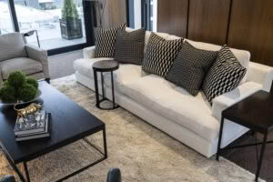 Modern living room with stylish patterned pillows on sofa