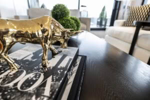 Golden bull sculpture on book in modern living room