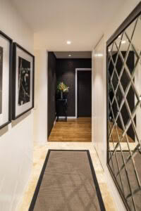 Modern hallway with framed art and decorative plant