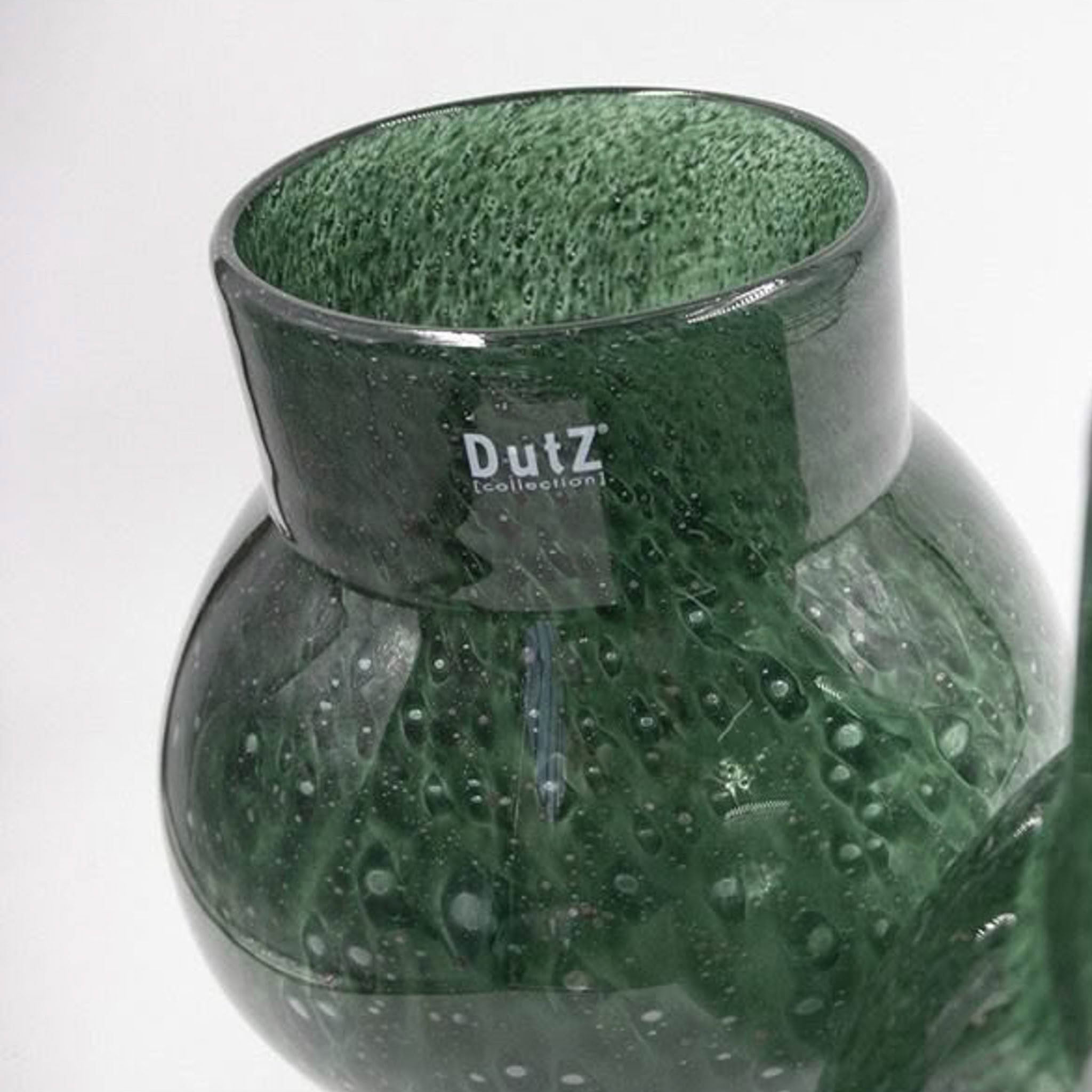 Green textured glass vase with Dutz Collection logo