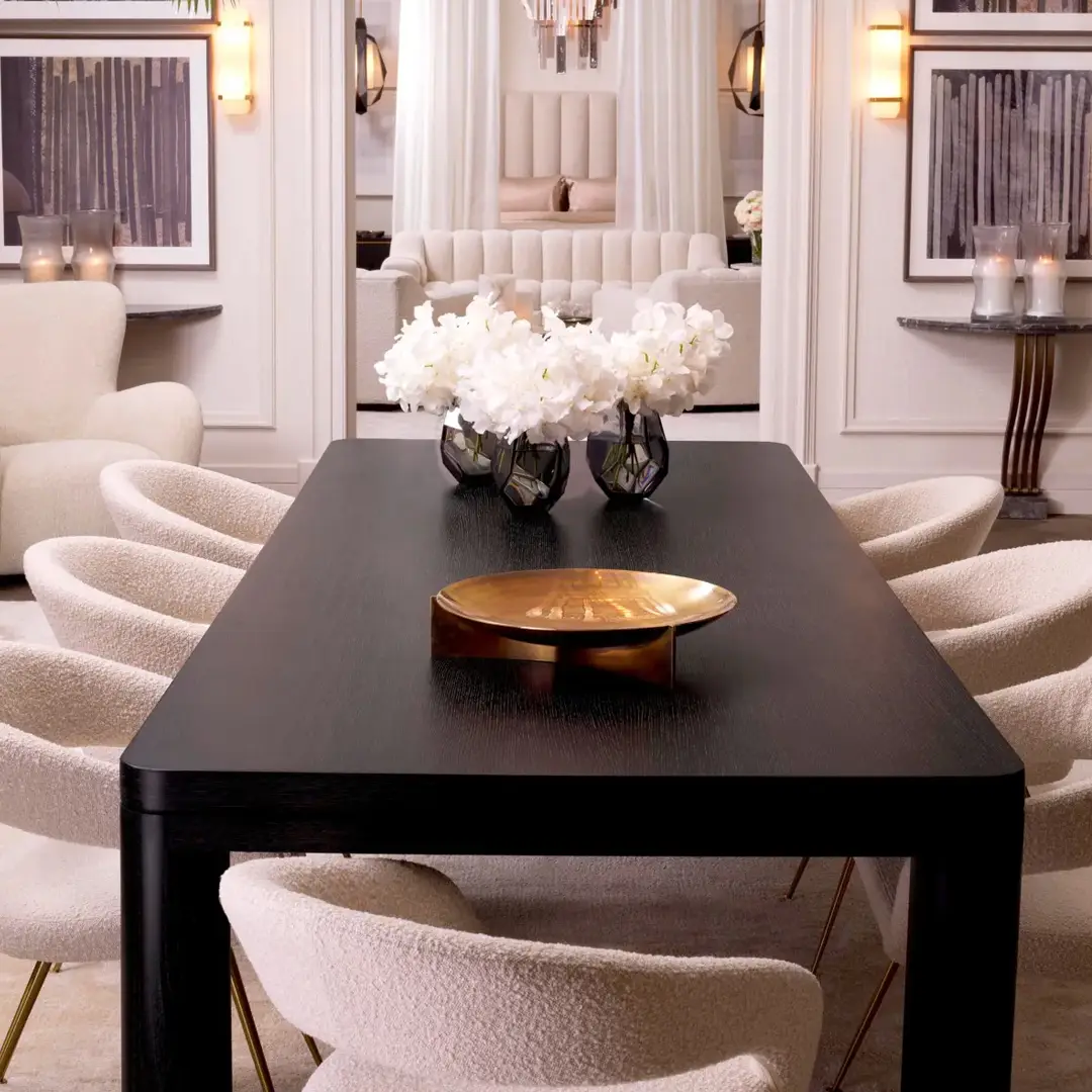 Elegant dining room with a black table and white chairs