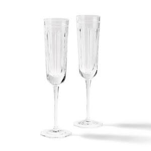 Two elegant clear champagne flutes on white background