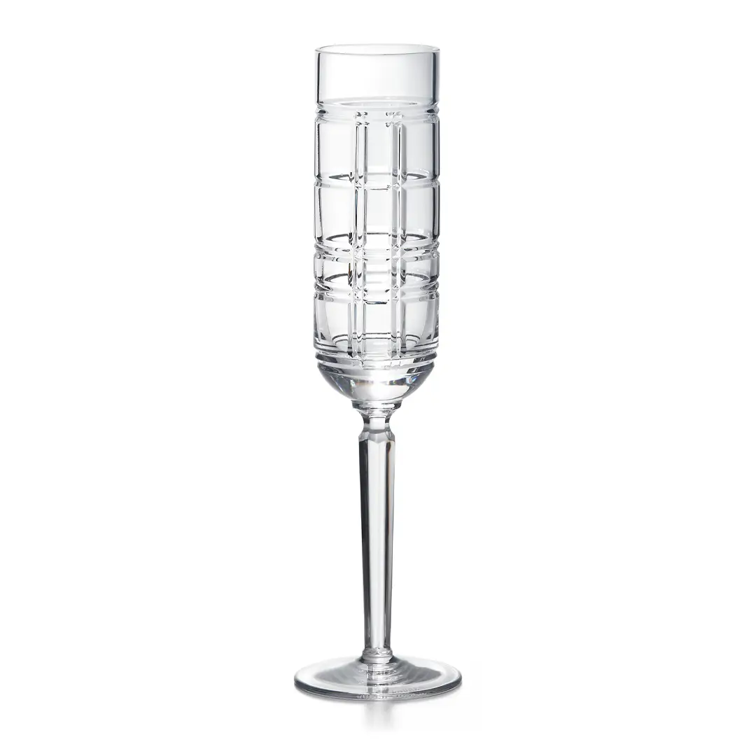 Elegant tall crystal champagne flute on white background