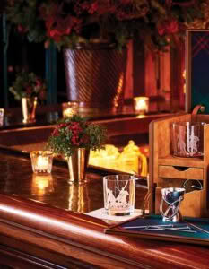 Elegant bar counter with festive decorations and glowing candles