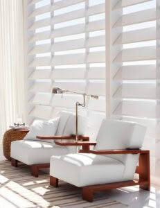 Modern white sofa set by sunny window with blinds