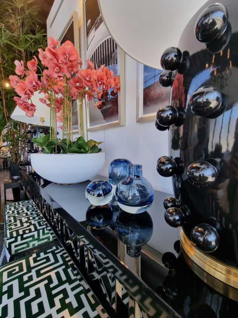 Elegant interior with orchids and reflective glass decor