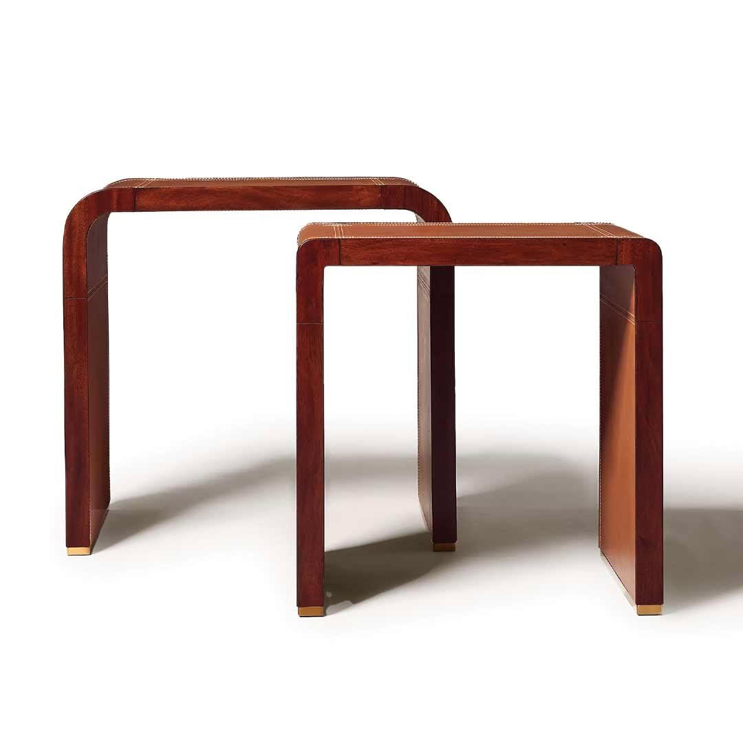 Elegant wooden nesting tables on white background