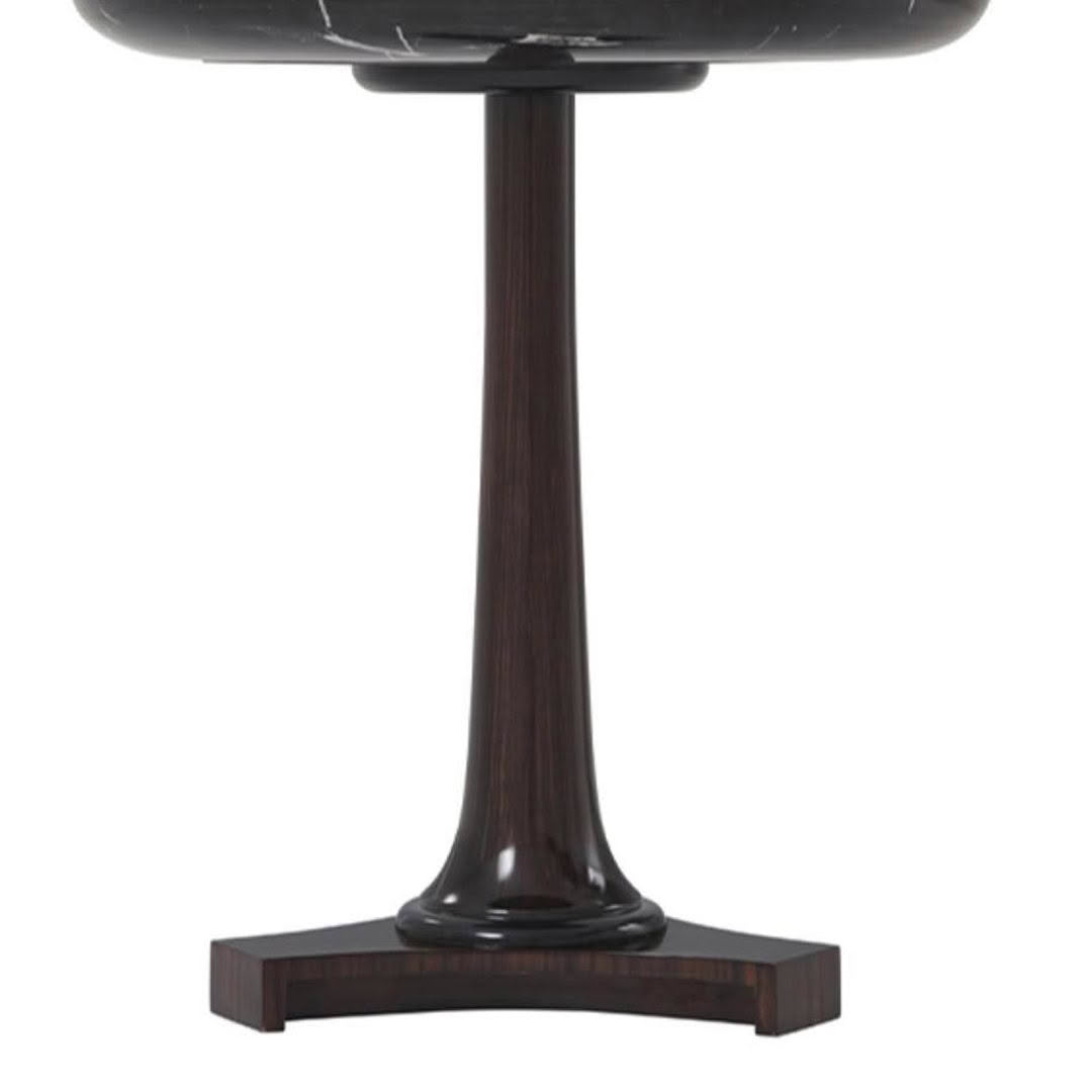 Dark brown pedestal table with sleek base