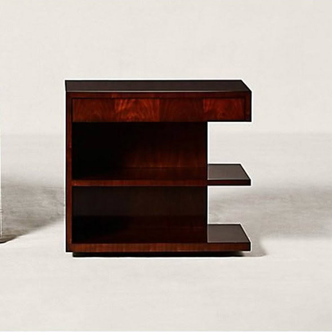 Modern wooden E-shaped bookshelf on plain background