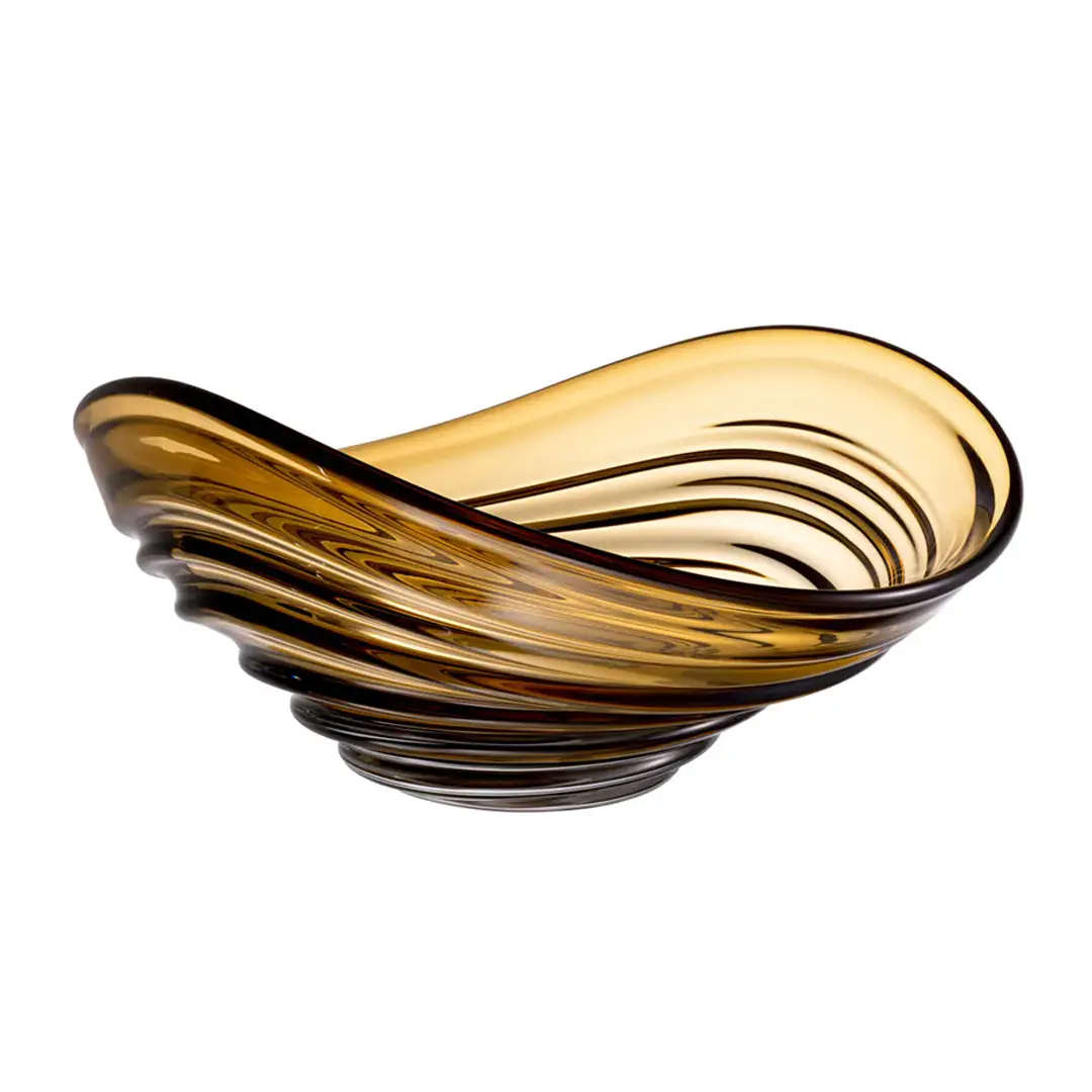 Swirled amber glass decorative bowl isolated on white