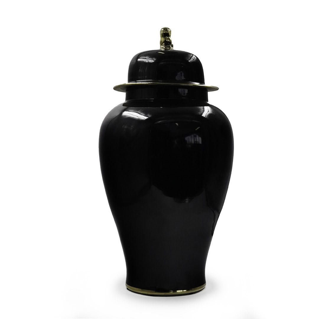 Black ceramic urn with golden trim isolated on white