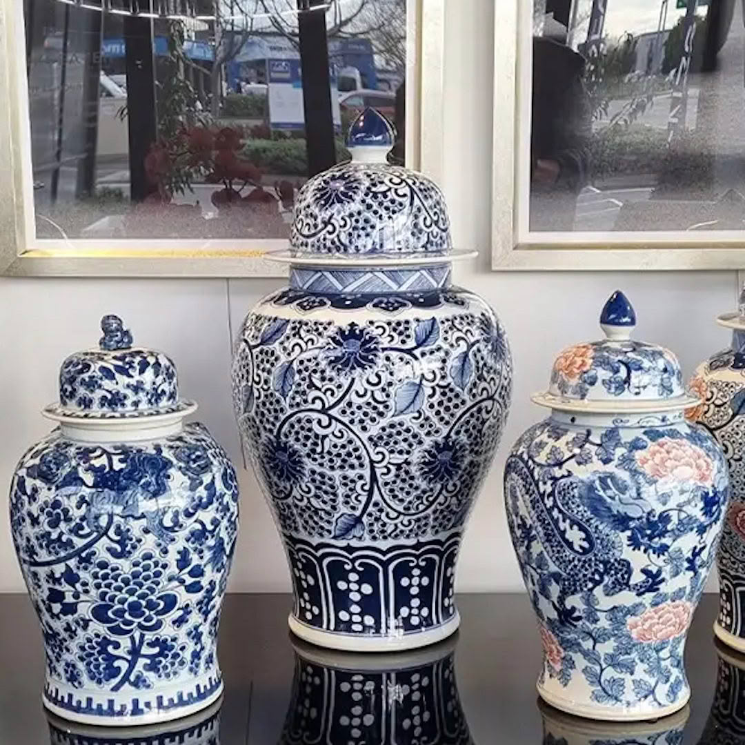 Blue and white ornate ceramic jars on display