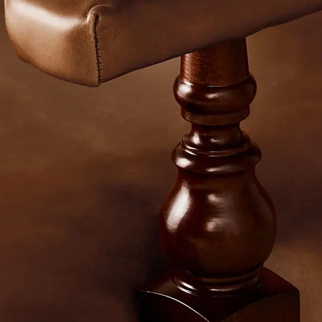Oliver-Chair_2 Close-up of sculpted leather head on wooden pedestal