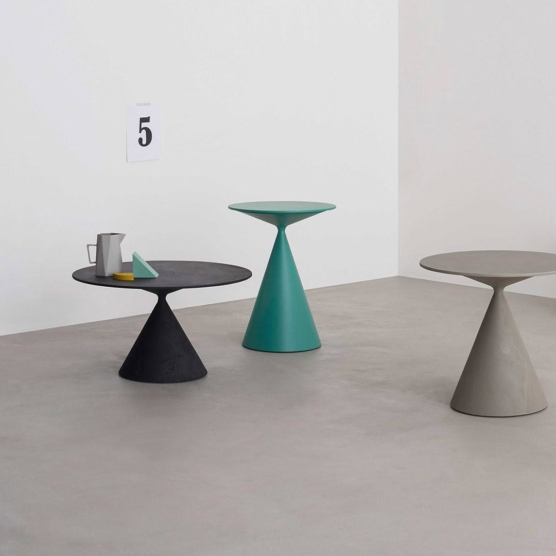 Modern minimalist tables in art gallery setting
