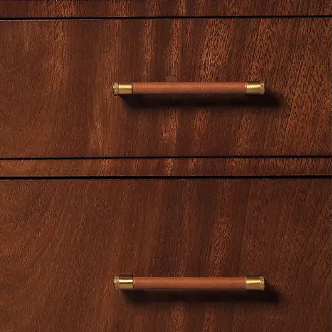 Thayer-Bedside-Chest Wooden cabinet with brass handles in close-up view